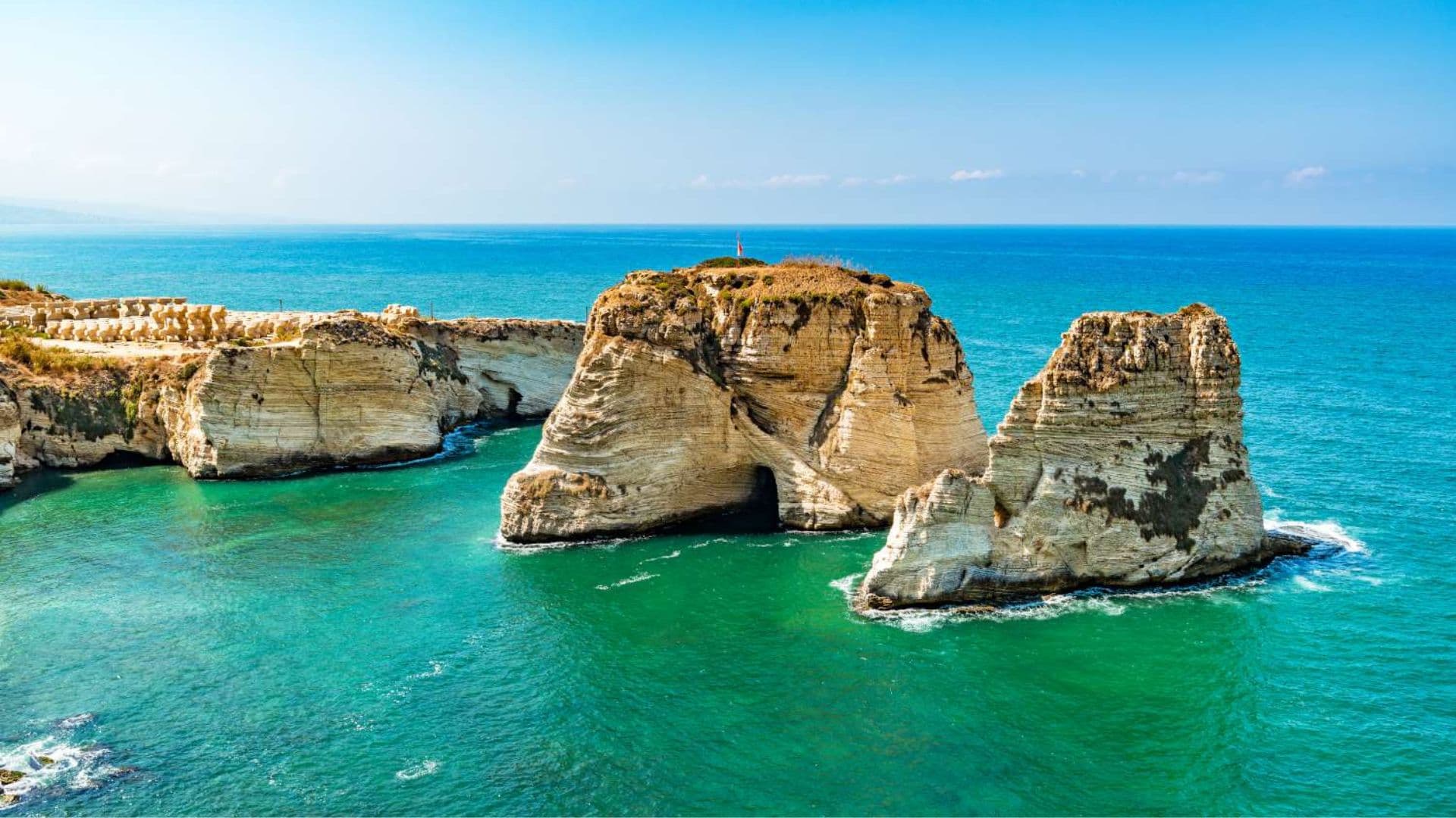 Raouché Pigeon Rocks rising from the turquoise Mediterranean off Beirut.